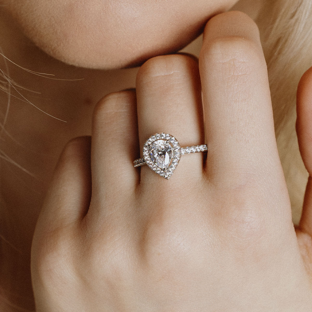 Teardrop shape silver ring with white zirconia and pave setting