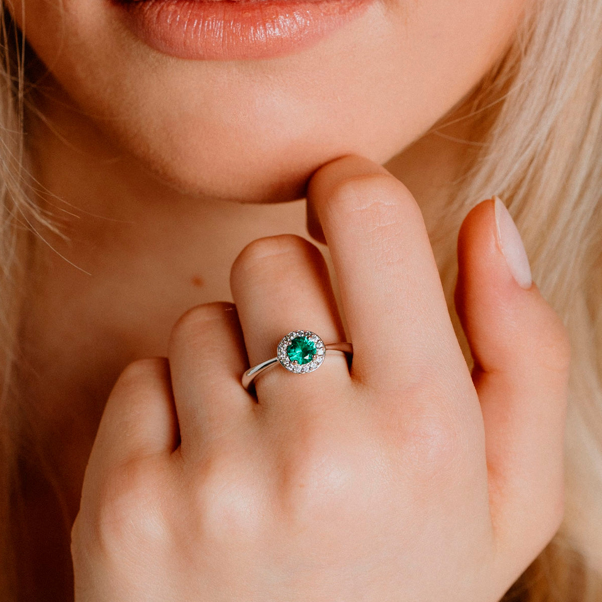 Solitaire silver ring with green zirconia and pave setting