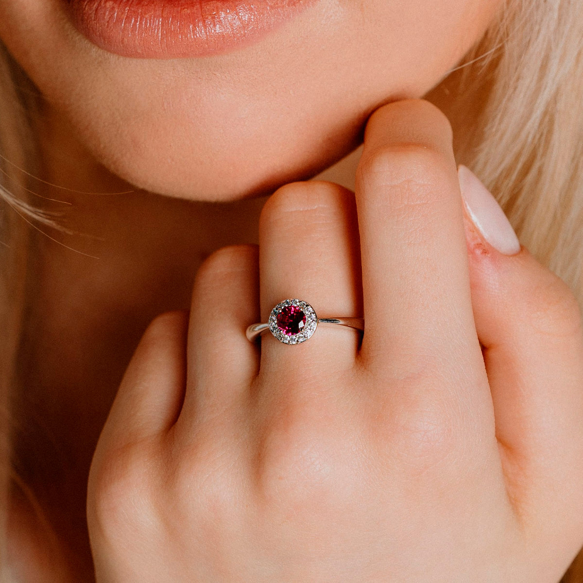 Solitaire silver ring with red zirconia and pave setting