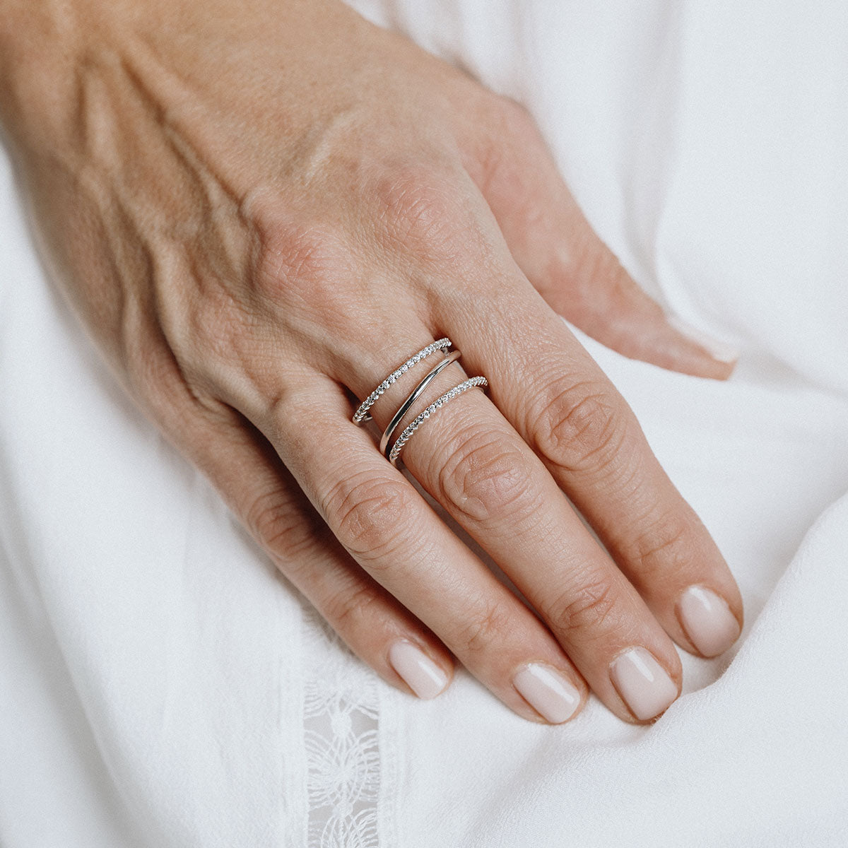 Spiral silver ring with stones