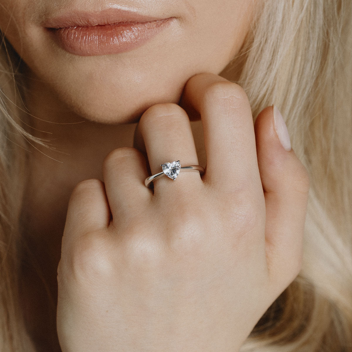 Silver heart shaped ring with white zirconia