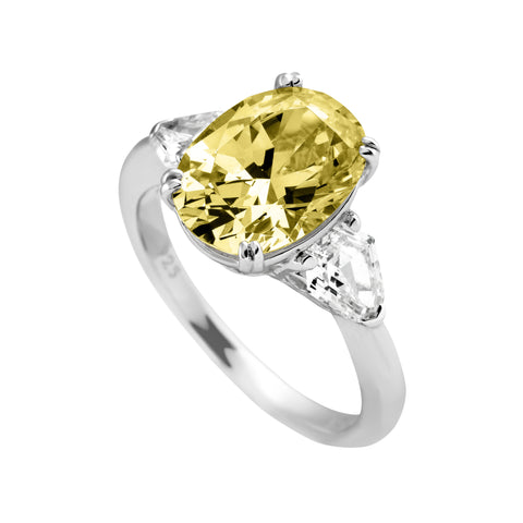 Yellow oval ring two white zircons