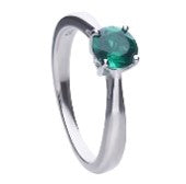 Silver solitaire ring with an emerald zirconia and prong setting