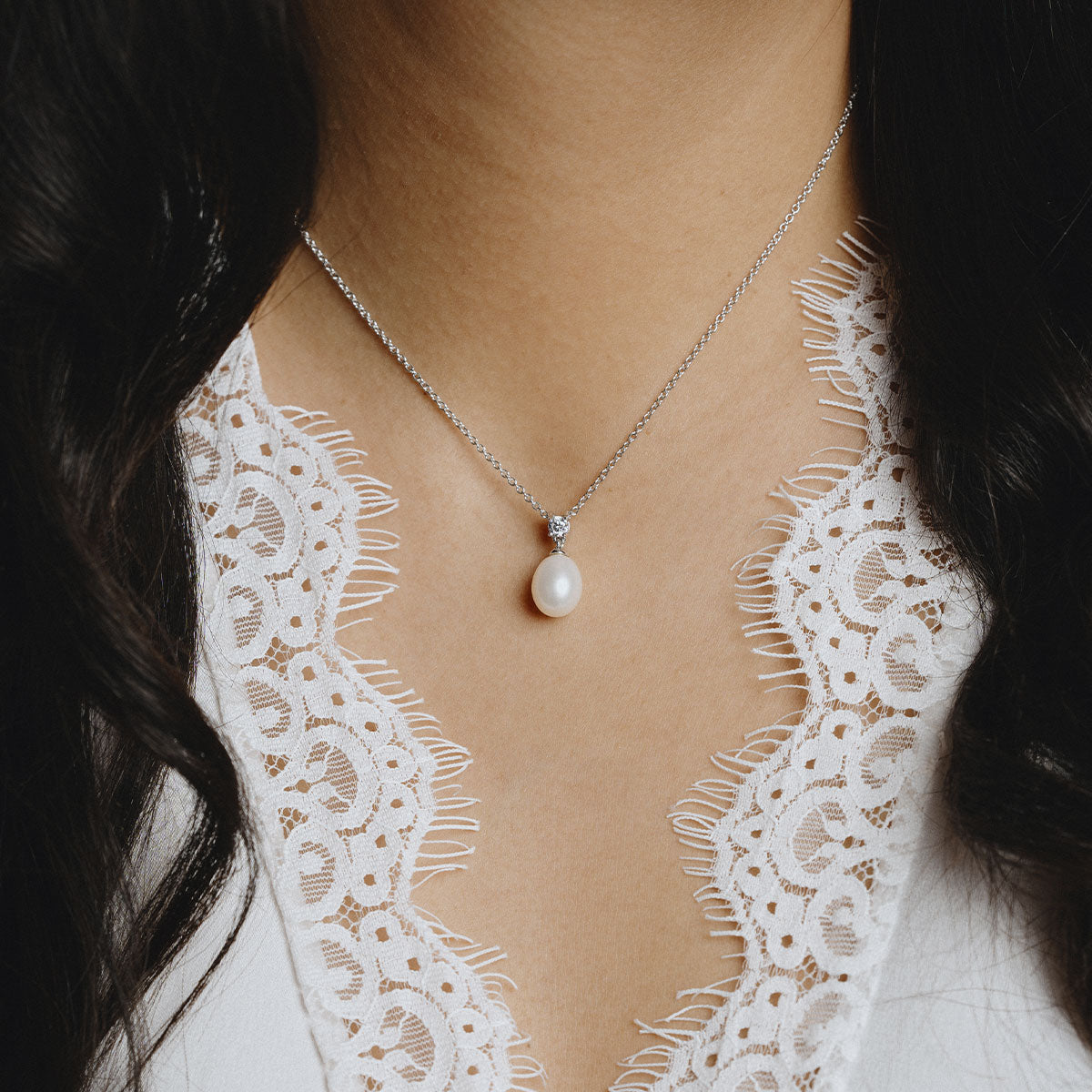 Oval shape pearl necklace with a white zirconia